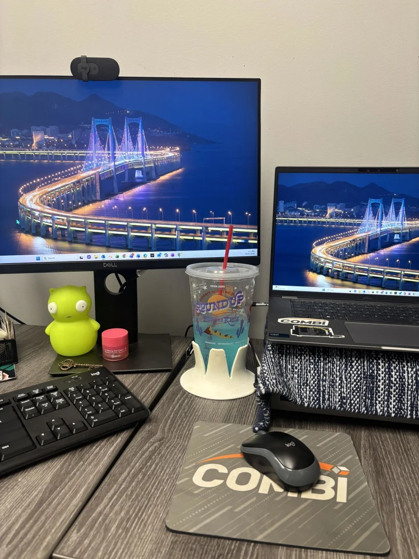 Customer Riley H’s photo of a drink in cream Steadi at a dual-monitor workspace